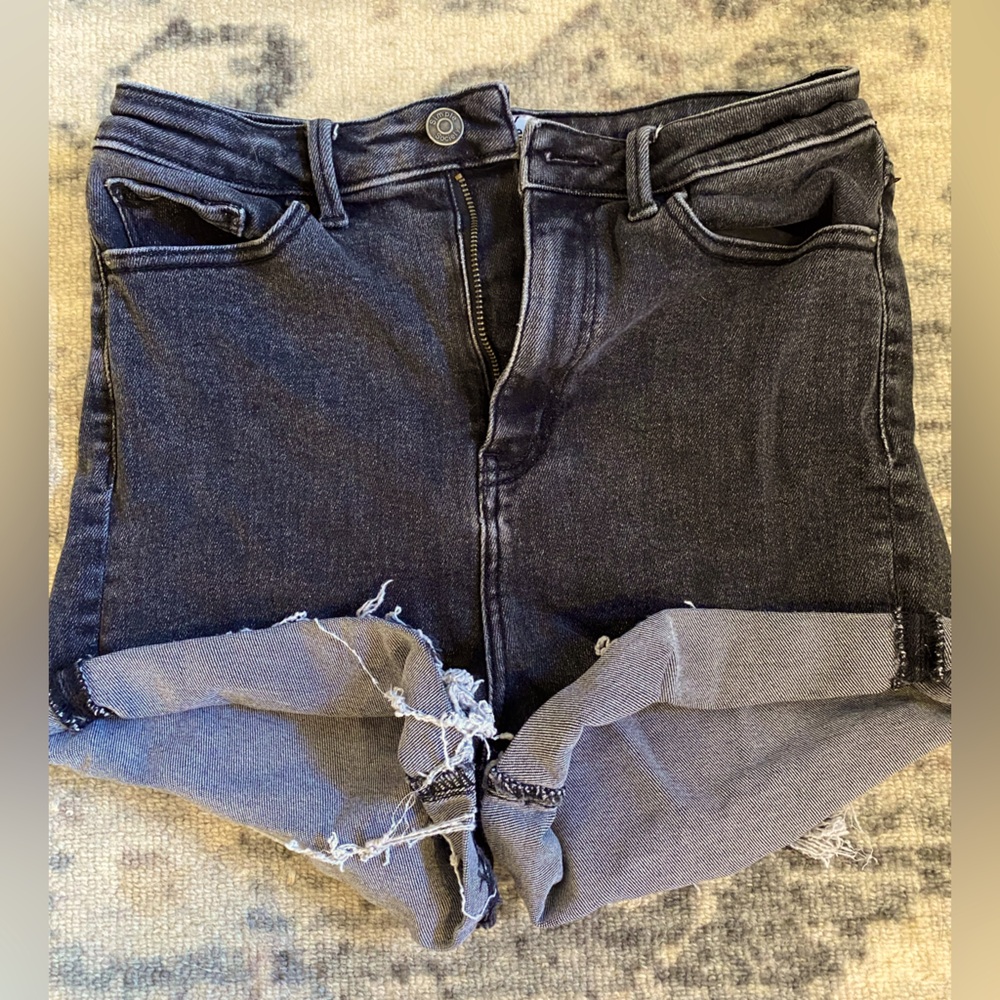 Black high rise jean shorts.